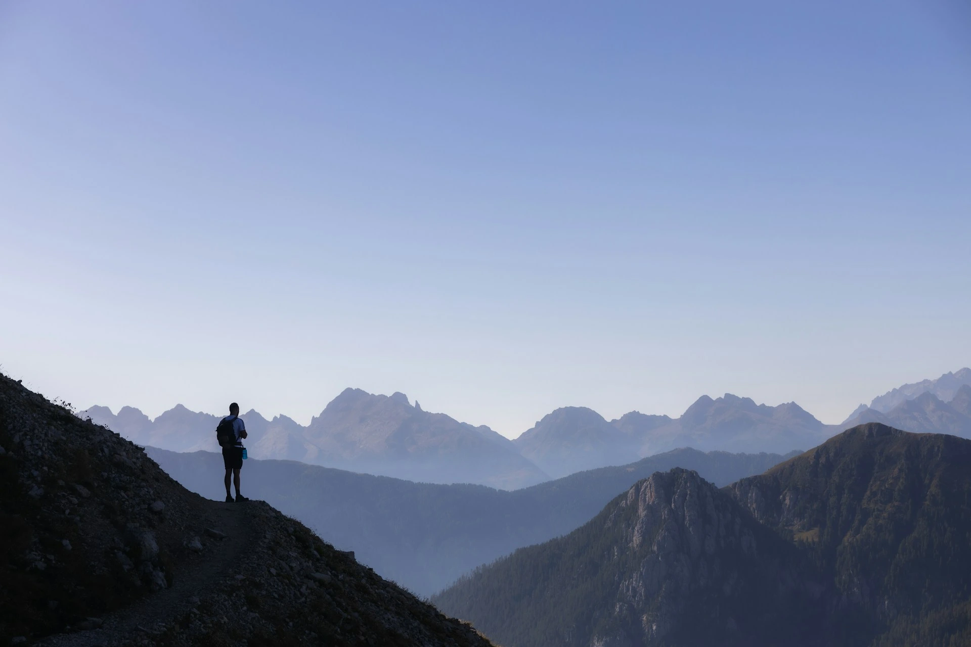 Mountain vista with hiker silhouette